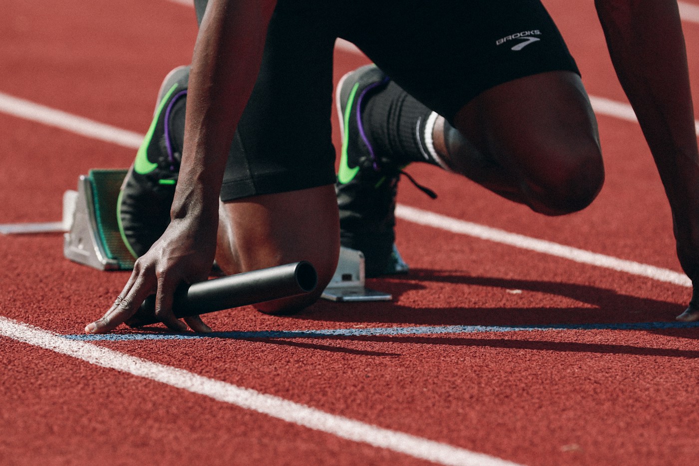 Runner preparing at the start of a track